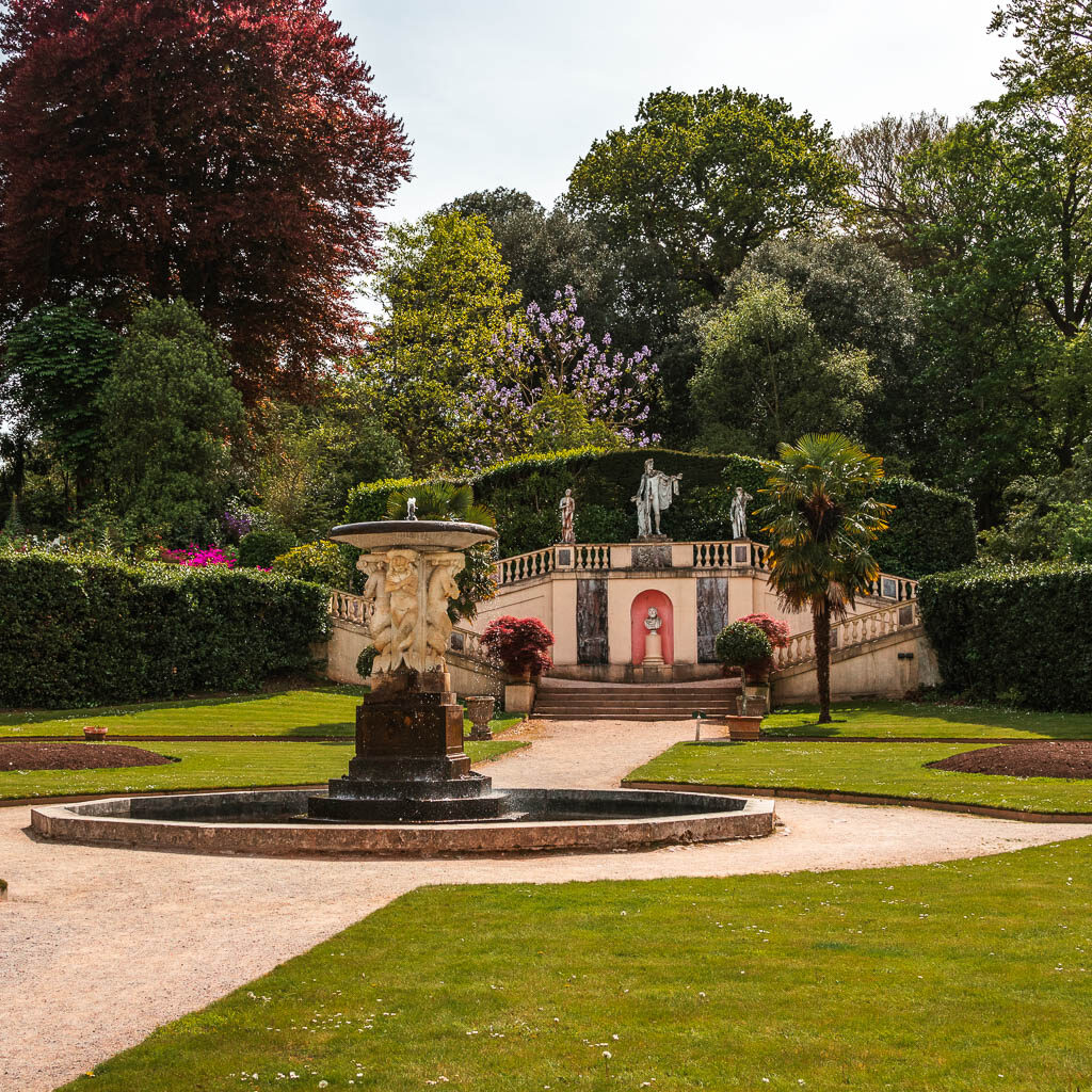 Looking along the neatly cute grass to a fountain in Mount Edgcumbe country park on the walk towards Kingsand.