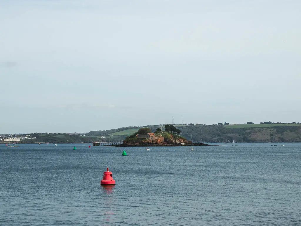 Looking across the blue sea towards Drakes Island.