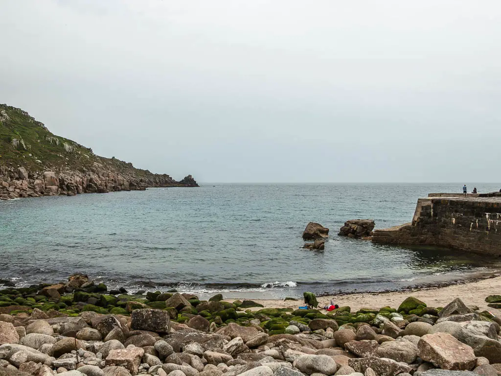 Looking across the rocks to the beach and then the sea on Larmona. 