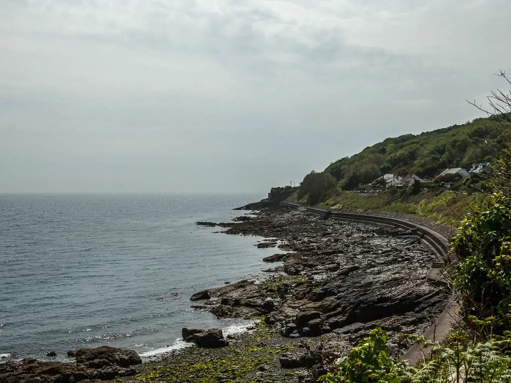 The rocky coastline as it curves around. 