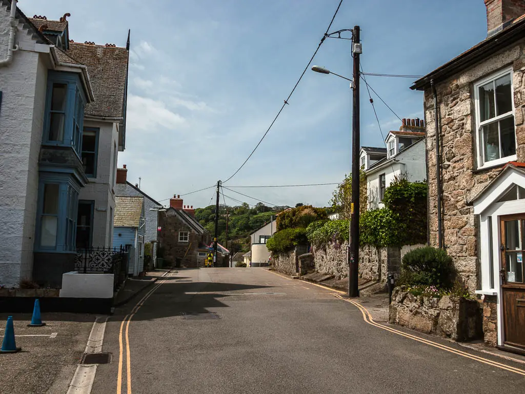 A road lined with houses.