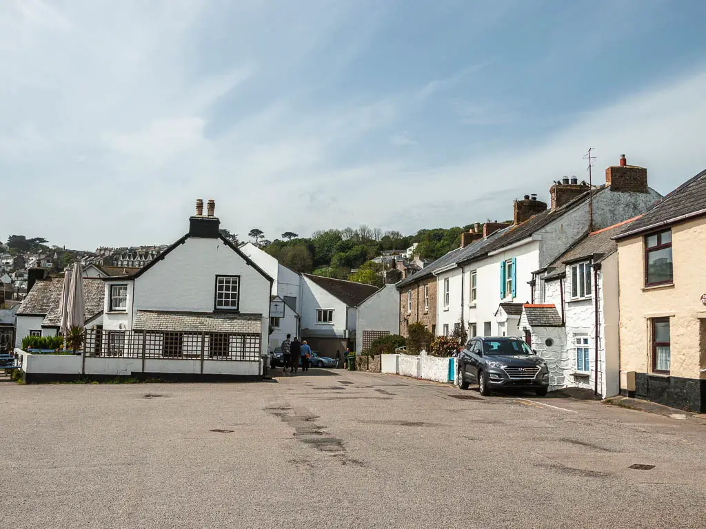 Looking across the car path to the row of houses.