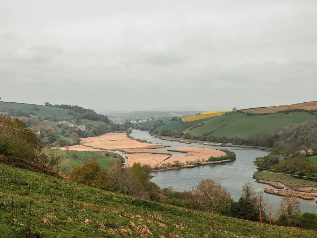 Looking down towards the river dart as it snakes through the valley, on the uphill walk on the trail.