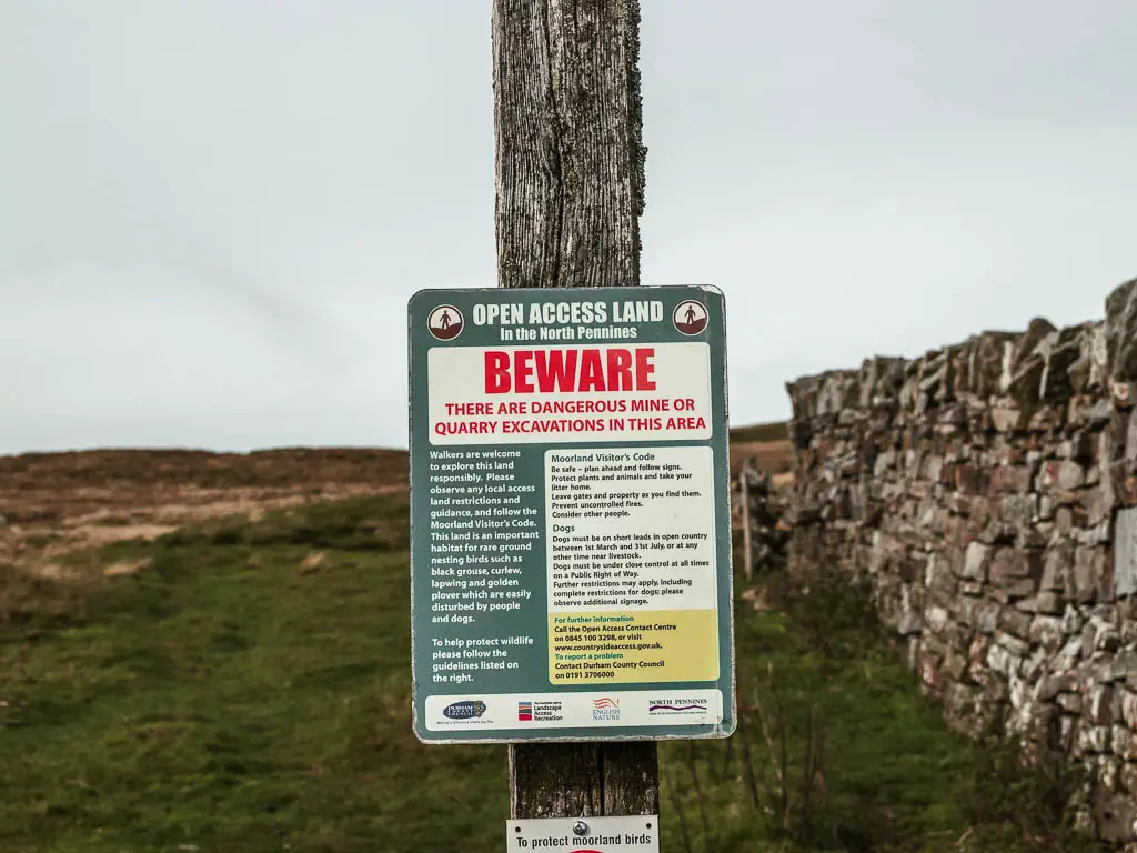 A warning sign in front of the field.