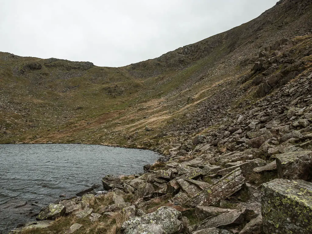 Masses of rocks leading around the right side of Goats water, on the walk towards the Old Man of Coniston.