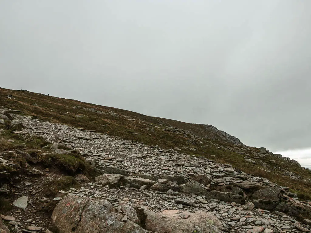 A flat rocked path up the hill.