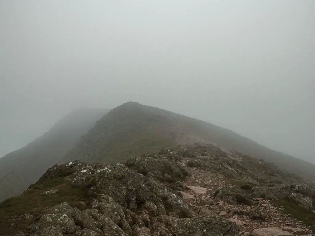 The ridge leading towards a peak on the Old Man of Coniston walk. Visibility is poor with all the fog and mist.