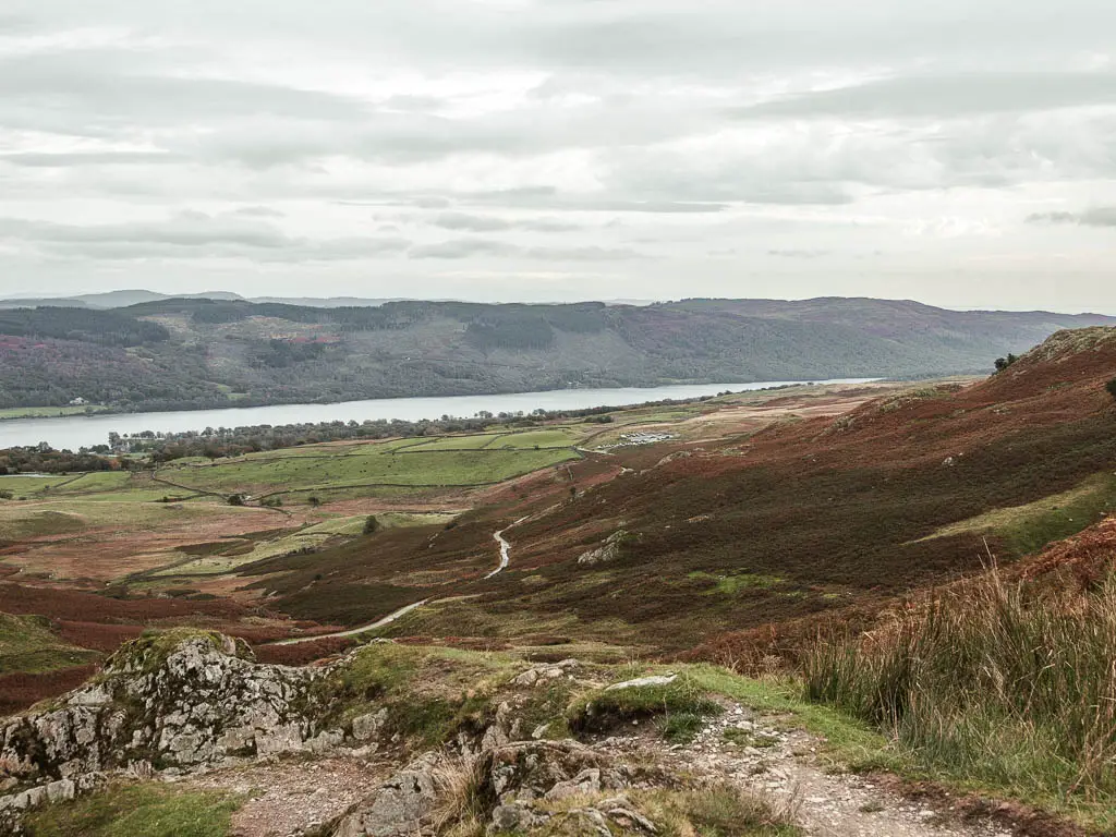 Looking down the hill to the fields and lake in the distance.