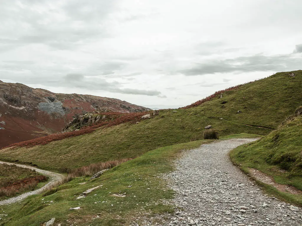 A gravel path curving to the right through the hill.