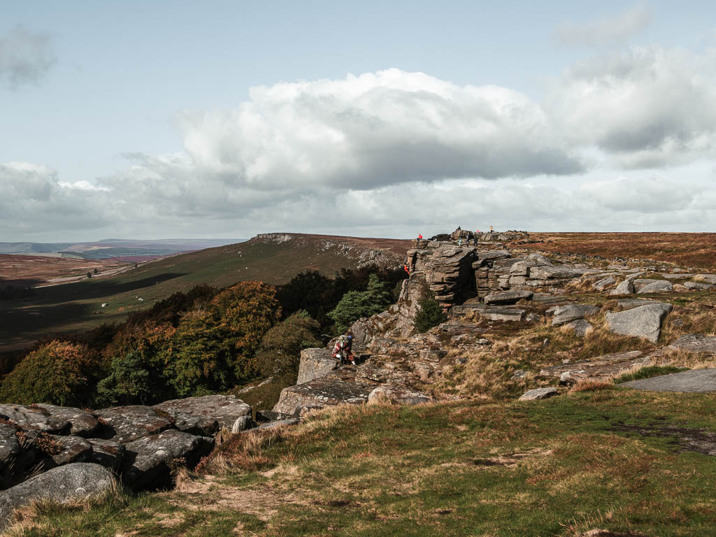 Looking along the side of the rock face to the Stanage Edge plantation below.