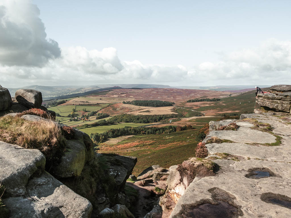 Looking through a gap in the rocks to the hills in the distance.