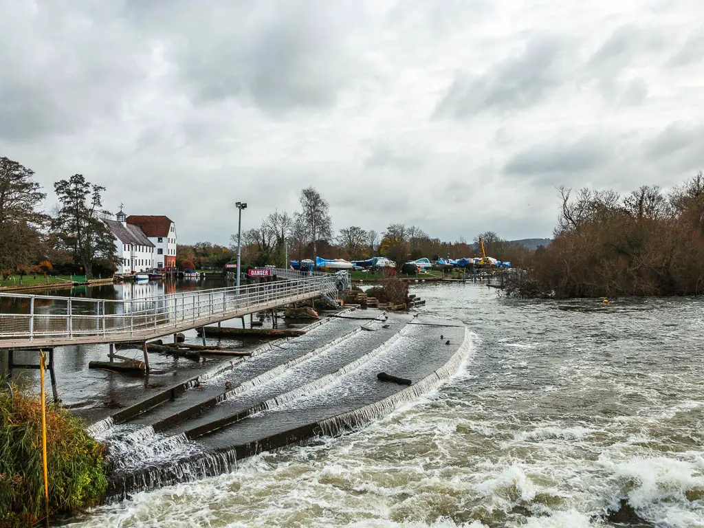 Looking down to the water gushing over the weir, along the Henley to Hambleden walk route.