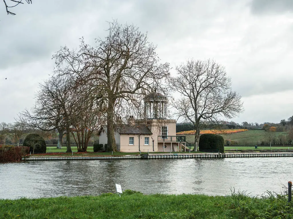 Looking towards the river thames and Temple Island, which is surround by leafless trees.