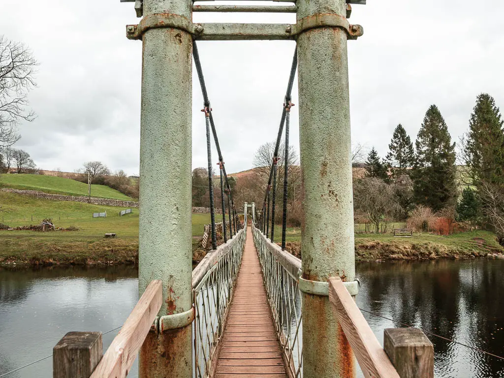 Looking down the middle of the Hebden suspension bridge, on the walk between Burnsall and Grassington.