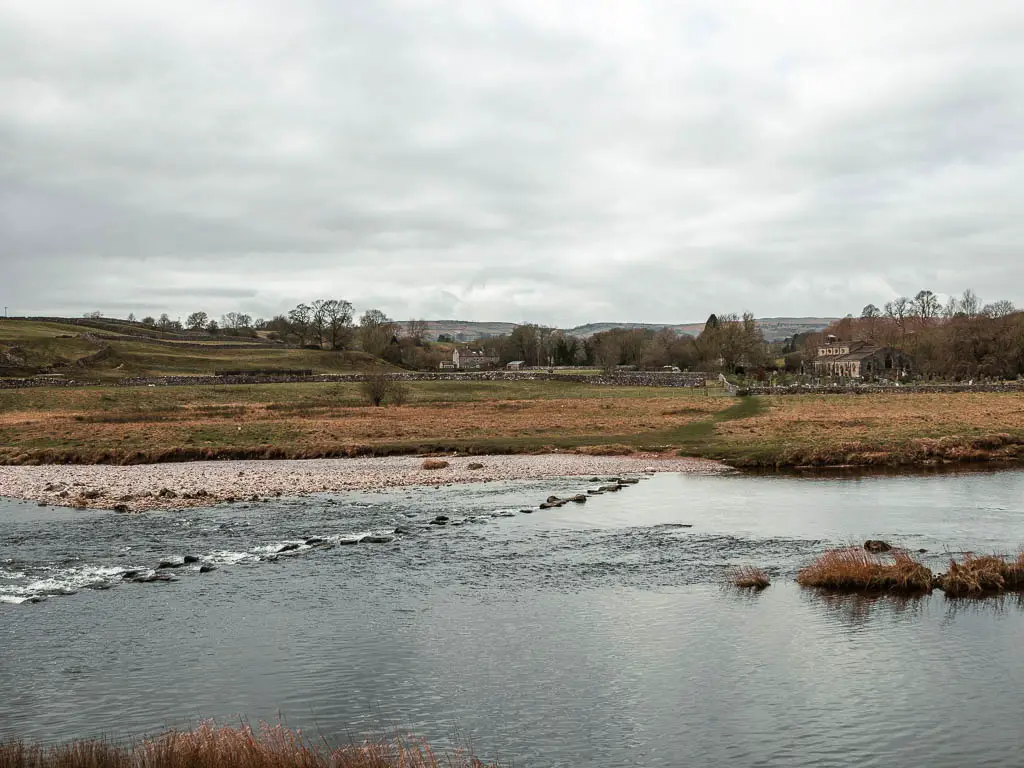 Stepping stones partially submerged by the river.