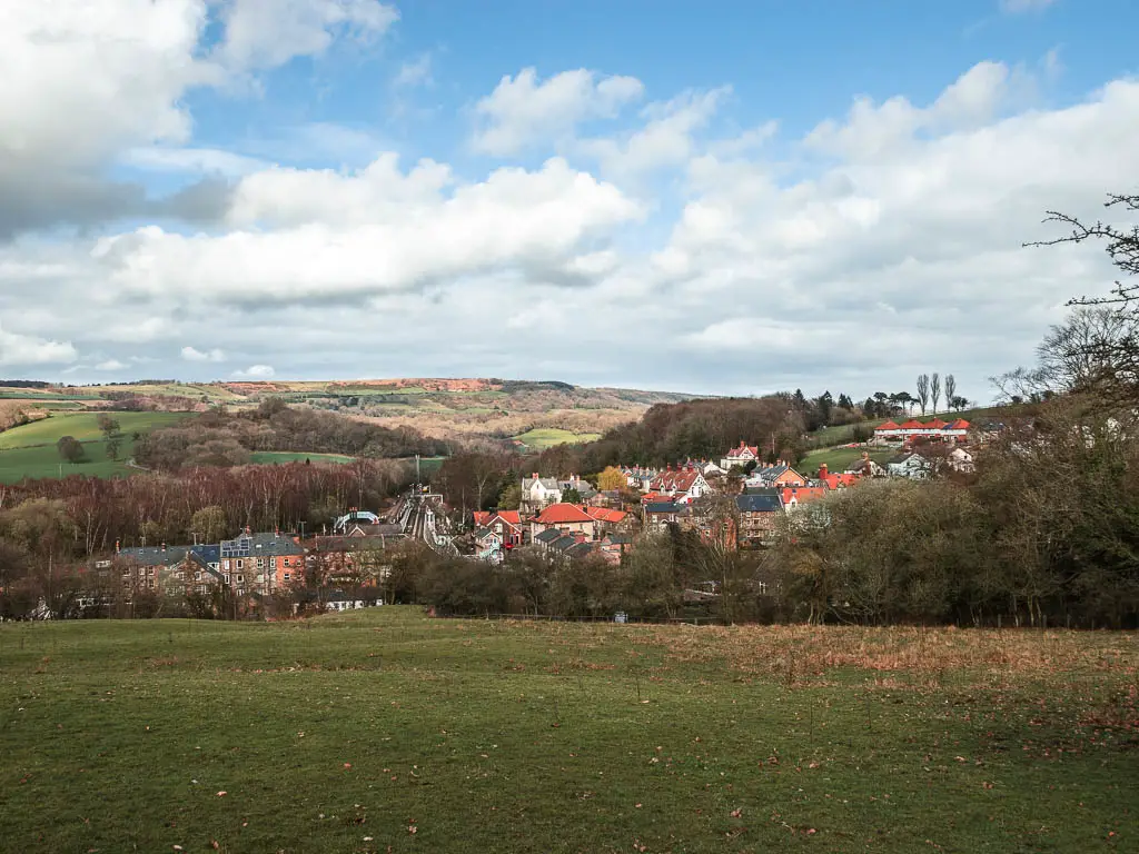 Looking down the hill to the rooftops of the village of Grosmont, on the rail trail walk from Goathland.