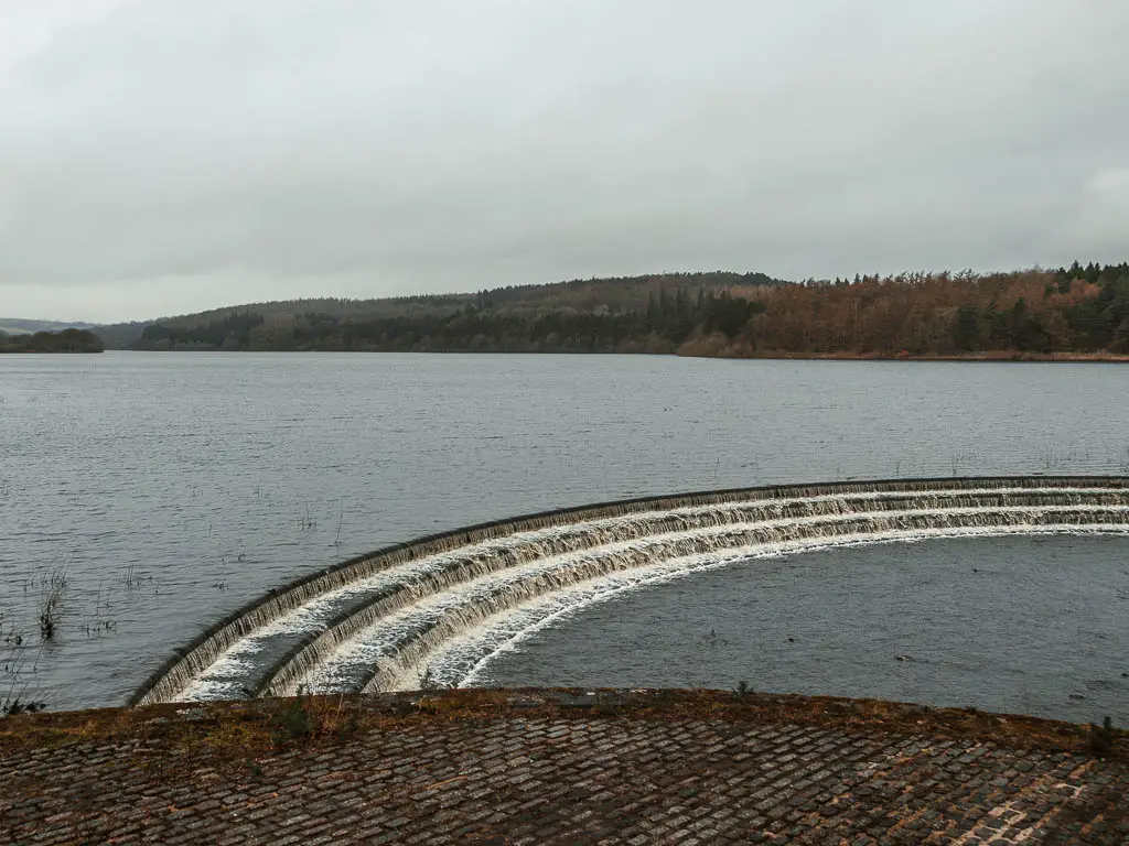 Looking across the water of the Fewston Reservoir, at the end of the walk arounds it. Way on the other side of the reservoir is woodland.