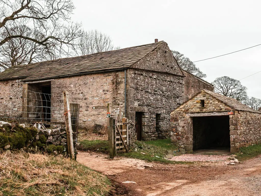 A junction with stone shed buildings. 