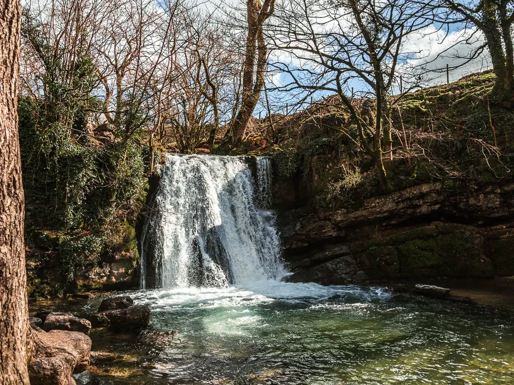 Janet's Foss waterfall gushing down and plunging into the pool below, on the walk towards Gordale Scar and Malham Cove.