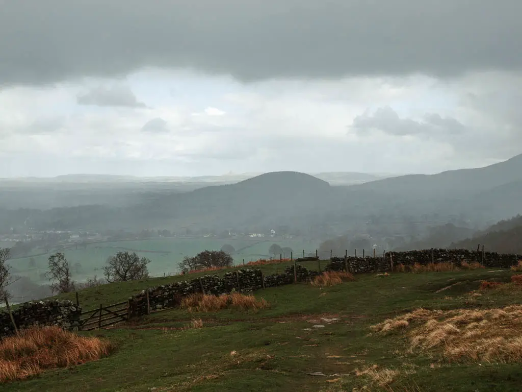 Looking down the hill to the mist covered hills as far as the eye can see.