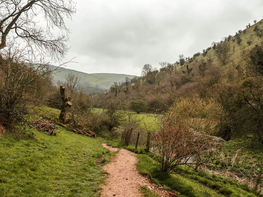 A path on the hill side through the valley.