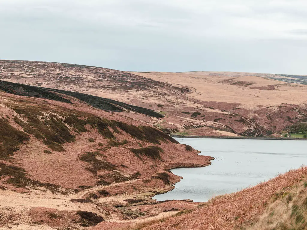 Looking down the hillside to the Wessenden Reservoir, with moorland hills rising up on the other side, part way through the walk.