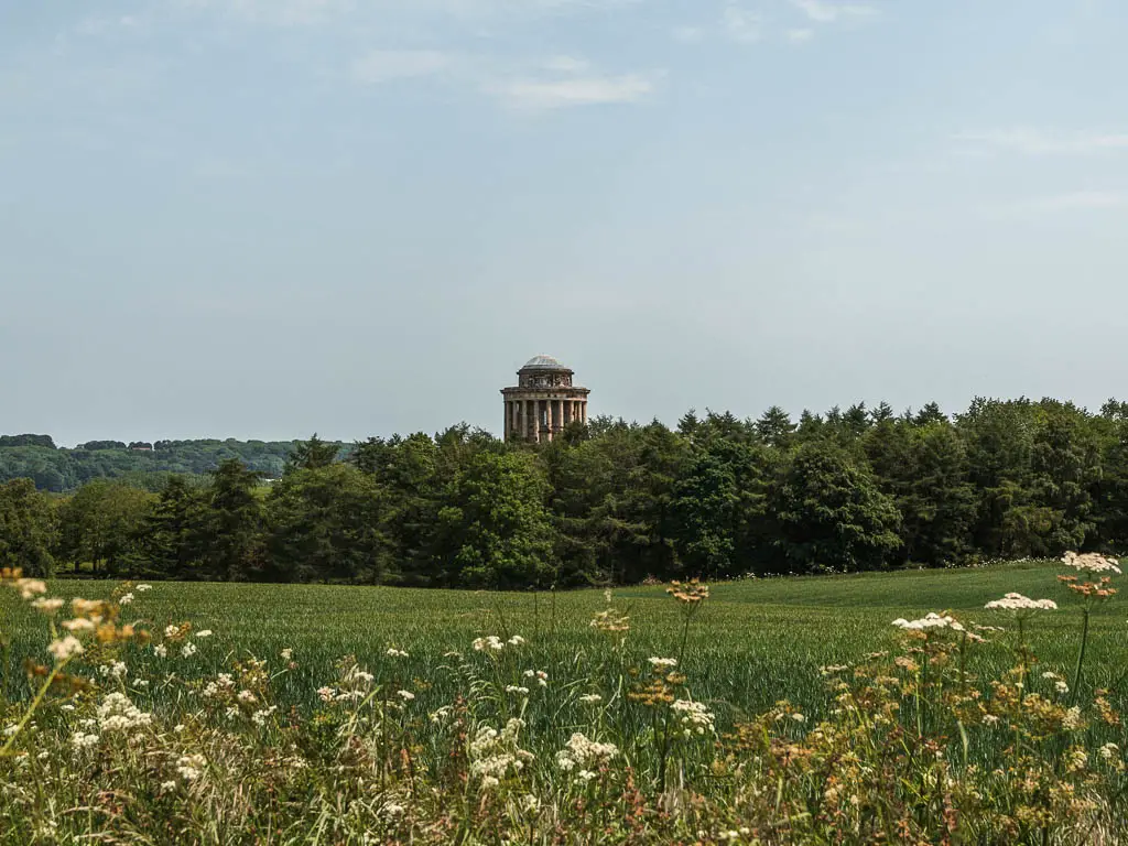 The Castle Howard Mausoleum sticking out above the trees, part way through the walk.