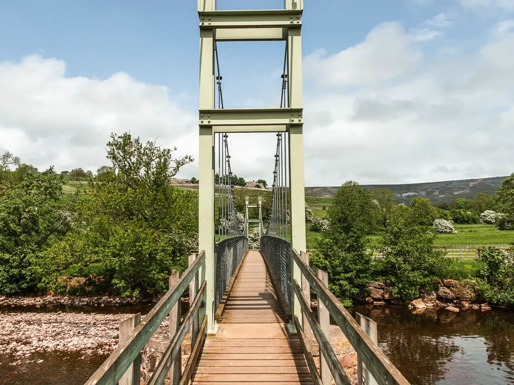 Looking along the swing bridge over the river, on the circular walk from Reeth.