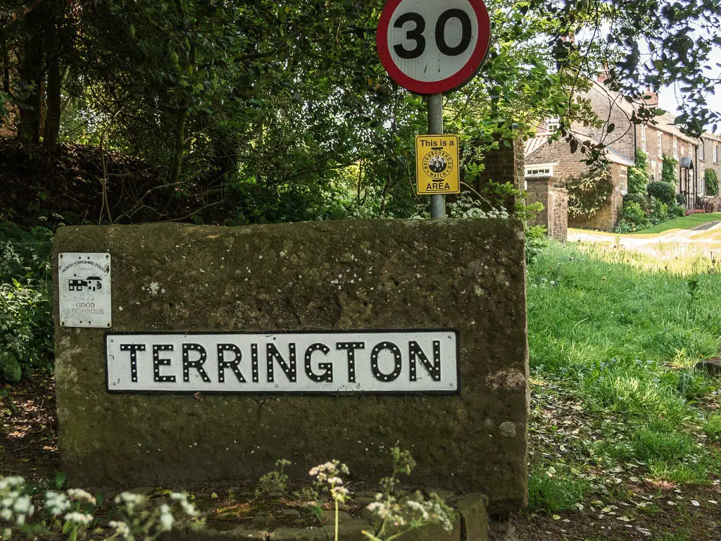 A large stone, with a sign saying 'Terrington', at the end of the walk.