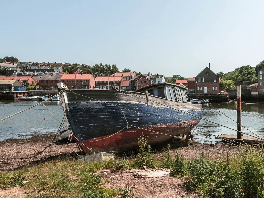 A wooden boat on the bank of the river Esk.