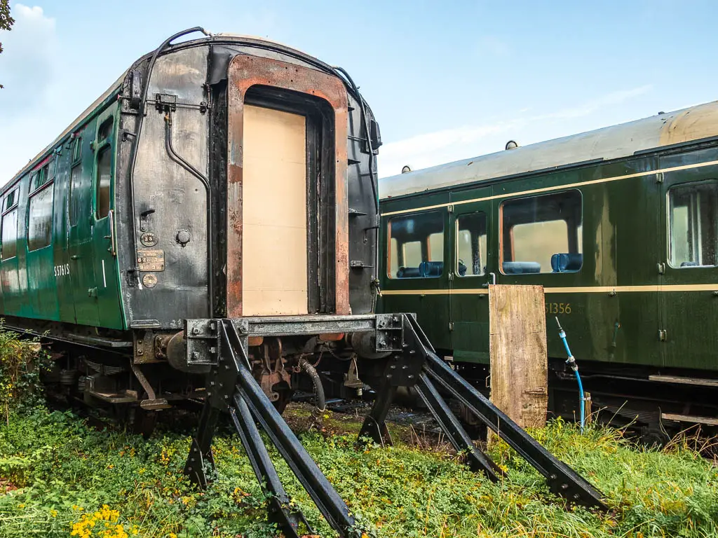 Green parked train carriages when leaving Corfe to walk towards Swanage.  