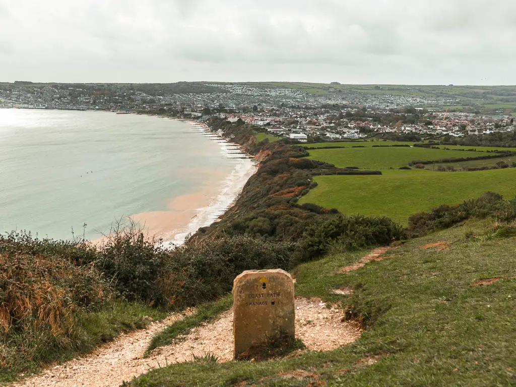 Looking down the grass hill along the coastline towards Swanage, near the end of the walk from Corfe Castle.