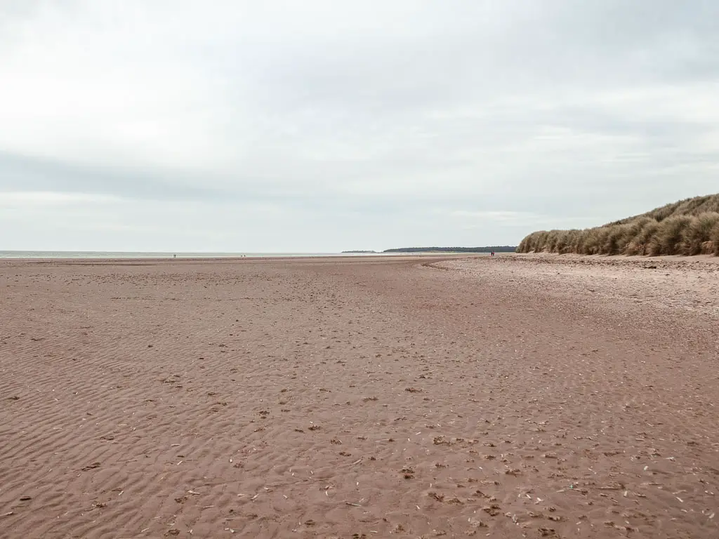 A big wide long stretch of sand of Holkham Beach, on the walk from Burnham Overy Staithe to Blakeney.