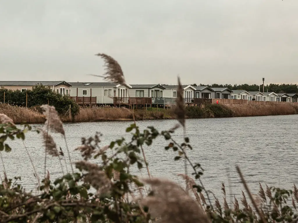 Looking across the river to holiday park homes on the other side.