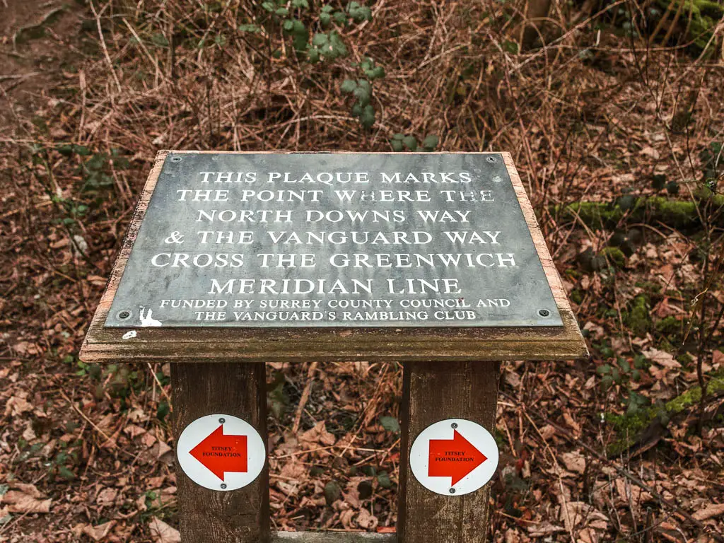 A plaque marking where the North Downs Way crosses the Greenwich Meridian Line.