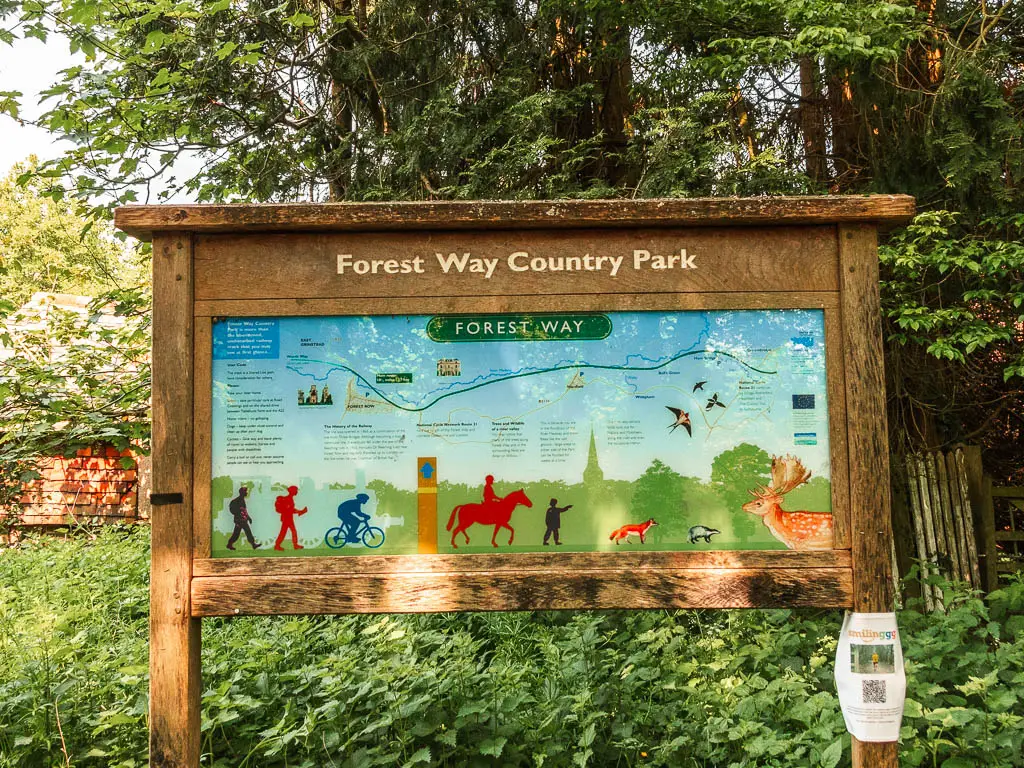 A wooden information board with a map for the Forest Way country Park.