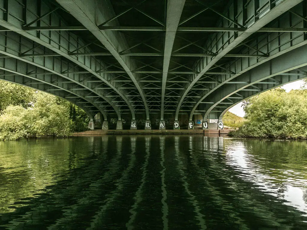 Looking across the river under the bridge with its reflections.