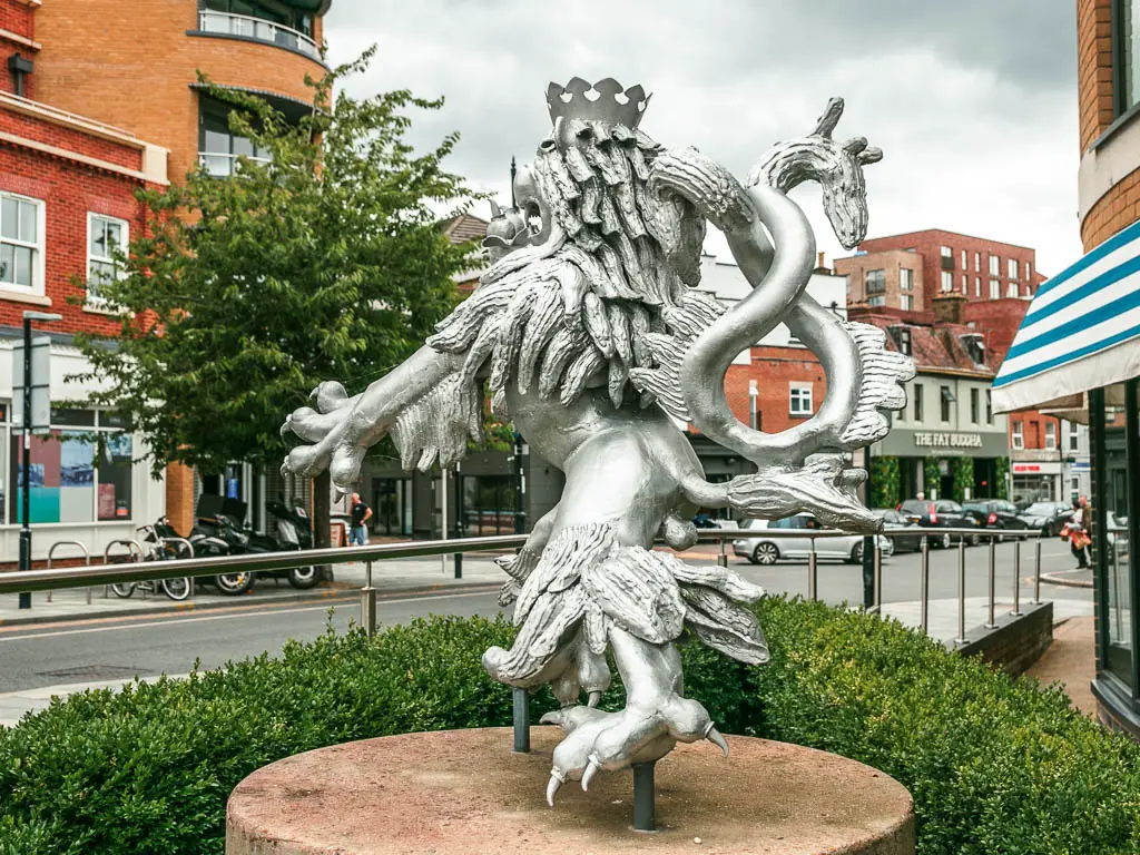 A big metal silver lion statue in Maidenhead.