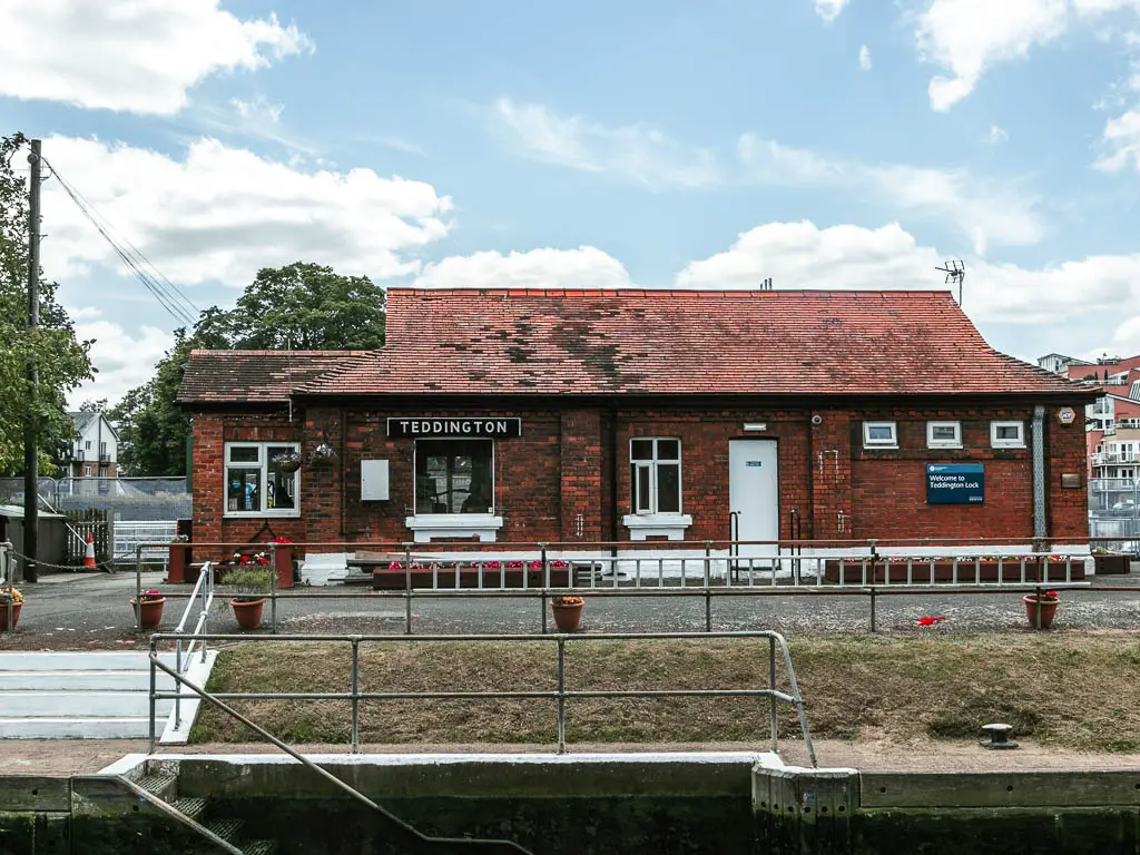 A red brick lock building saying 'Teddington'. 