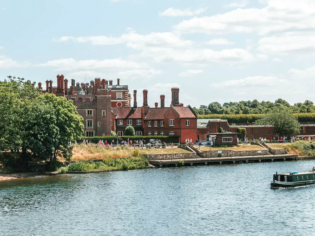 Looking across the river to Hampton Court on the other side, at the start of the walk towards Putney. 