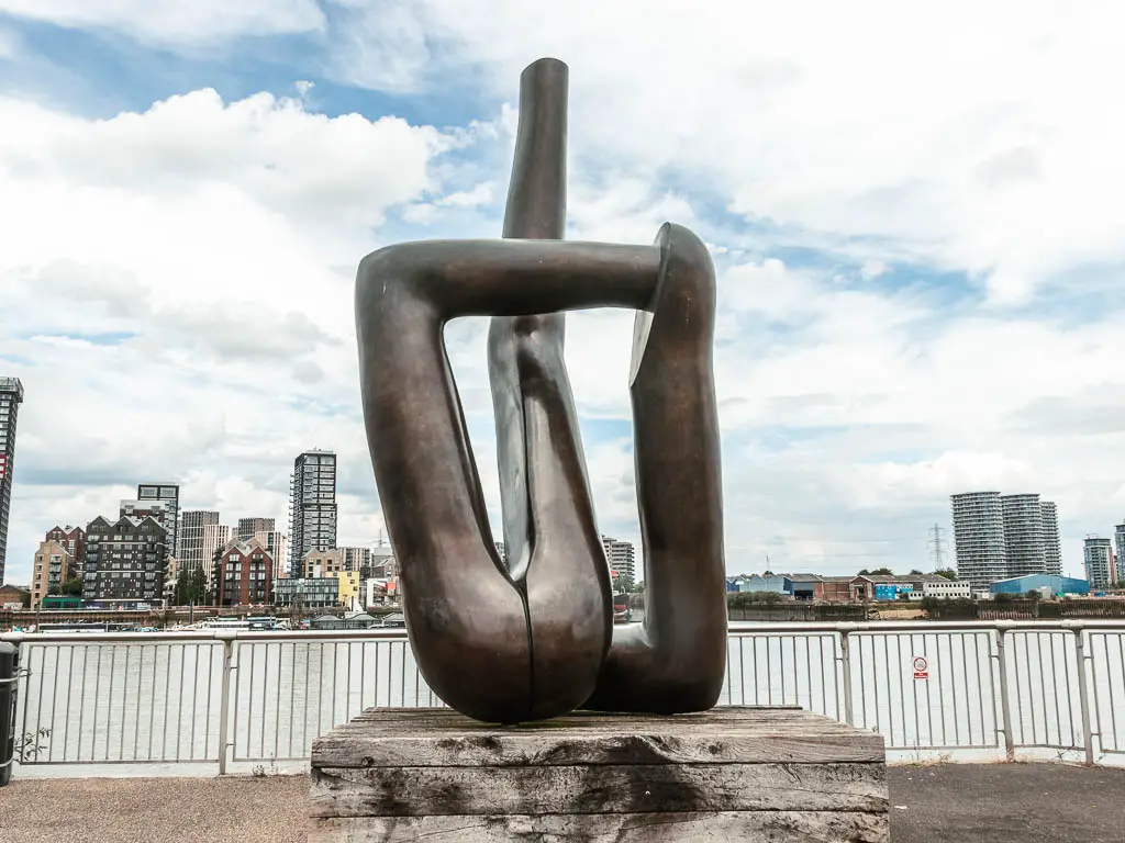 A sculpture in front of the river.