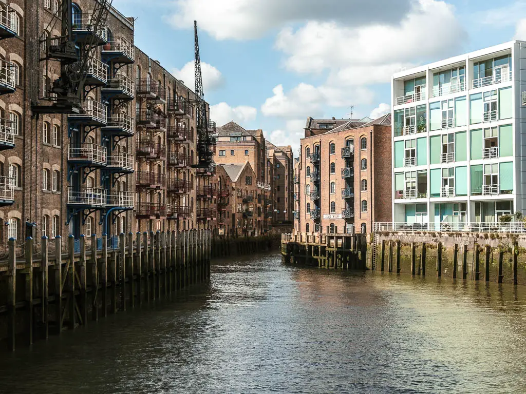 Looking along the river offshoot running between old apartments buildings.