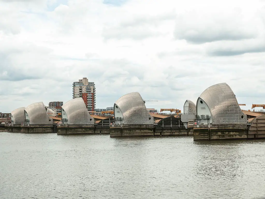 Looking towards the Thames Barrier across the river, on the the walk from Tower Bridge.