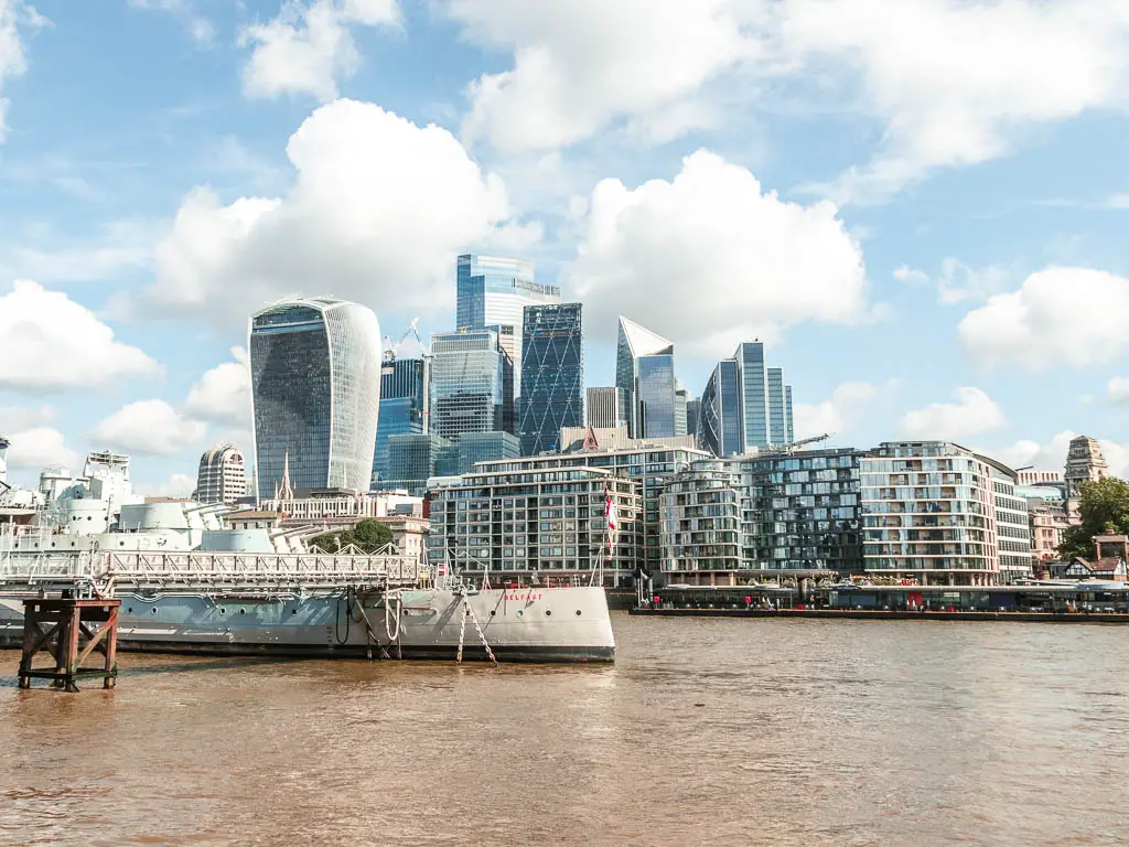 Looking across the river to the skyscrapers of the city of London, at the start of the walk from Tower Bridge to the Thames Barrier.