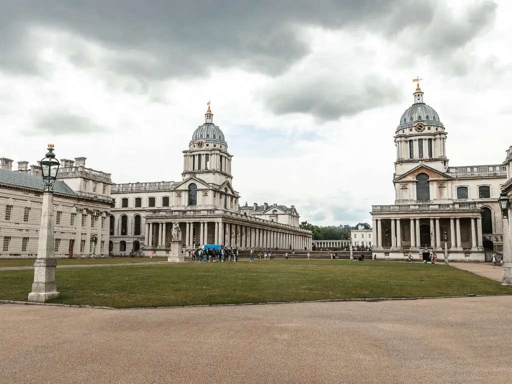 Looking across the green courtyard surrounding by palatial buildings in Greenwich. 