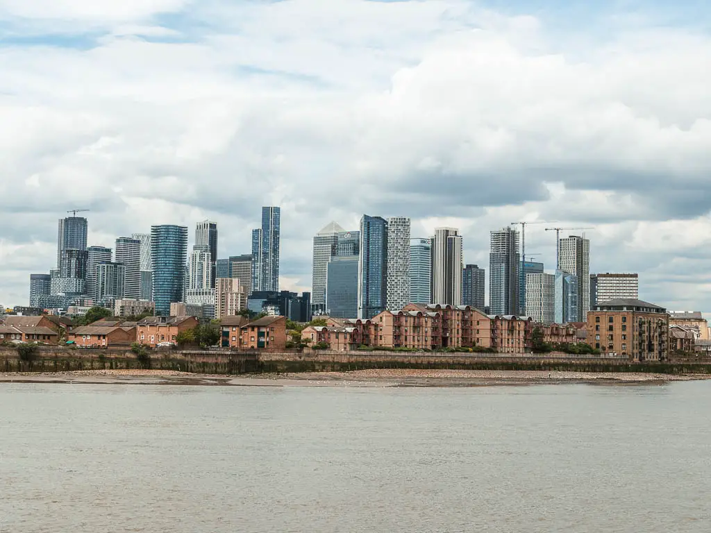 Looking across the river to the skyscrapers of Canary Wharf, partway through the walk from Tower Bridge to the Thames Barrier.